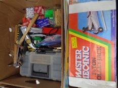 A box containing various hand tools, toolbox, tape measures,