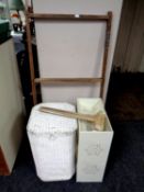 A painted loom linen basket together with a wall mounted clothes airer and a folding clothes airer,