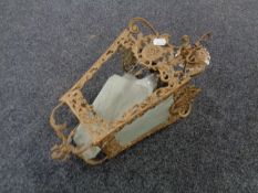 A continental gilt metal hanging light fitting with three etched frost glass panels