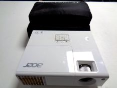 An Acer television projector in carry bag