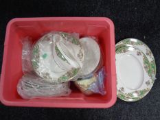 A box containing a quantity of John Maddock & Sons Vitreous green and gilt dinner ware