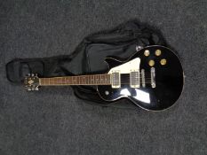 A Hondo electric guitar in carry bag