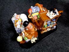 A tray containing four Ringtons novelty teapots