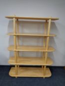 A set of contemporary pine d-shaped open shelves