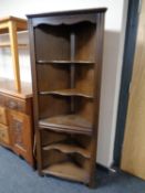 An oak effect corner cabinet