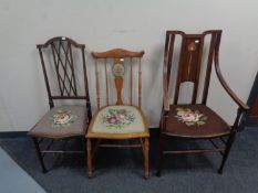 A stained beech Art Nouveau armchair with a tapestry upholstered seat together with a further two