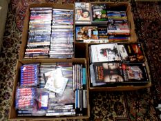 Four boxes containing a quantity of various CDs,