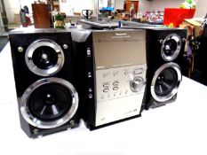 A Panasonic CD stereo system with remote