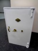 A painted fire and heat resistant safe by Whittingham Brothers Limited of Dudley with one key