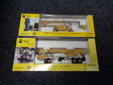 A Grove Manlift AMZ131XT combustion powered articulating boom together with a Grove Crane ATS540