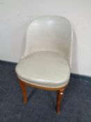An Art Deco walnut cocktail chair in vinyl upholstery