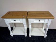 A pair of reclaimed pine lamp tables on painted bases