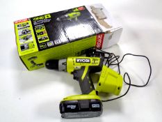 A boxed Ryobi 18 volt hammer drill