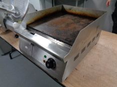 A stainless steel commercial griddle