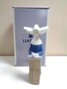 A Lladro figure of a kneeling nun at prayer,