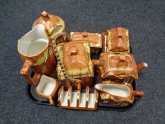 A tray containing assorted cottage ware to include teapots, coffee pots, cruet sets,