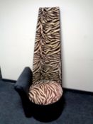 A contemporary zebra patterned high back chair