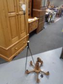 A mid 20th century standard lamp on tripod stand and a beech wood five branch chandelier