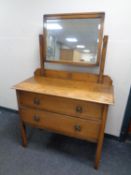 An Edwardian oak dressing chest