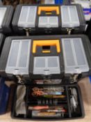 Three plastic toolboxes containing a large quantity of assorted hand tools