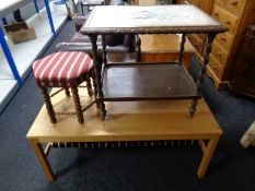 A Danish pine coffee table with web fabric under shelf,