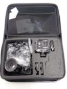 An Amazon Basics 4K Ultra HD action camera in case with accessories