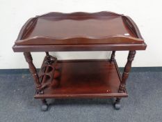 A Victorian style four tier what not stand and a trolley with lift off tray