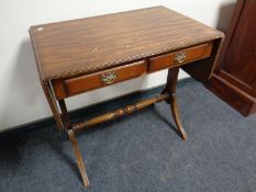 A mahogany flap sided sofa table fitted two drawers