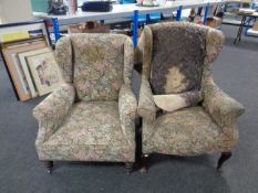 Two Edwardian wingback armchairs upholstered in a floral fabric (for reupholstery)