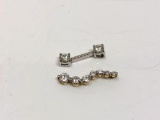 An 18ct white gold CZ pendant, together with another yellow gold CZ pendant, indistinctly stamped.