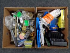 Two boxes containing tools, hardware, extension leads, battery charger,