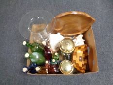 A box containing assorted glass bottles, cafetieres, shells,