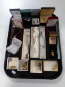 A tray of a quantity of costume jewellery to include marcasite earrings, pendants on chains,