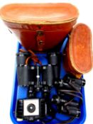 A tray of two pairs of leather cased binoculars by Silraft and Viper,