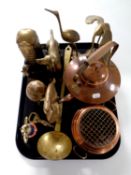 A tray containing assorted brass ornaments, telephone money box, ladle,