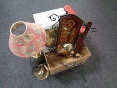 A box containing new wall clocks, angle poise lamp, brass table lamp with shade,