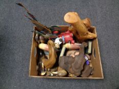 A box containing wooden animal ornaments to include fish bookends, ducks,