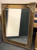 An ornate bevelled mirror,
