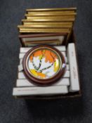 A box containing gilt framed prints,