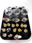 A tray containing a set of six etched champagne glasses, brass and crystal mice band figures,