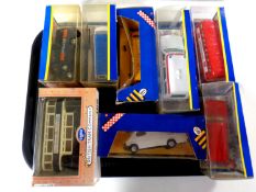 A tray containing 10 boxed Corgi die cast vehicles to include trams,