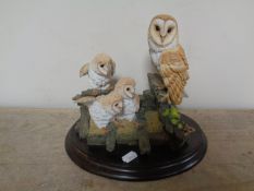 A Royal Doulton sculpture of a barn owl family,