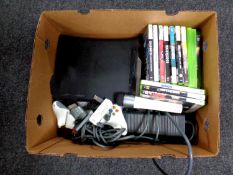 A box containing an X Box 360, leads,