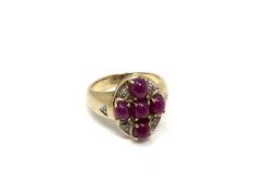 A 9ct gold cabochon ruby cluster ring, size N.
