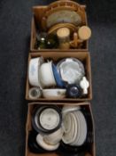 Three boxes containing assorted dinner plates and bowls, kitchen storage jars,
