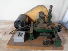A vintage key cutting machine