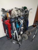 Four golf bags containing assorted irons and drivers to include Donnay, Howson, Hippo etc,
