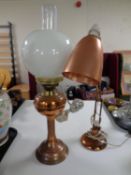 A copper and brass oil lamp with chimney and shade (converted),