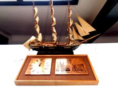 A wooden model of a 19th century clipper together with a 1970's teak framed copper and etched panel
