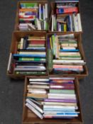 Five boxes containing hardback and paperback books to include dictionaries, cookery,